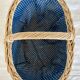Large vintage wicker basket and blue lining with white polka dots
