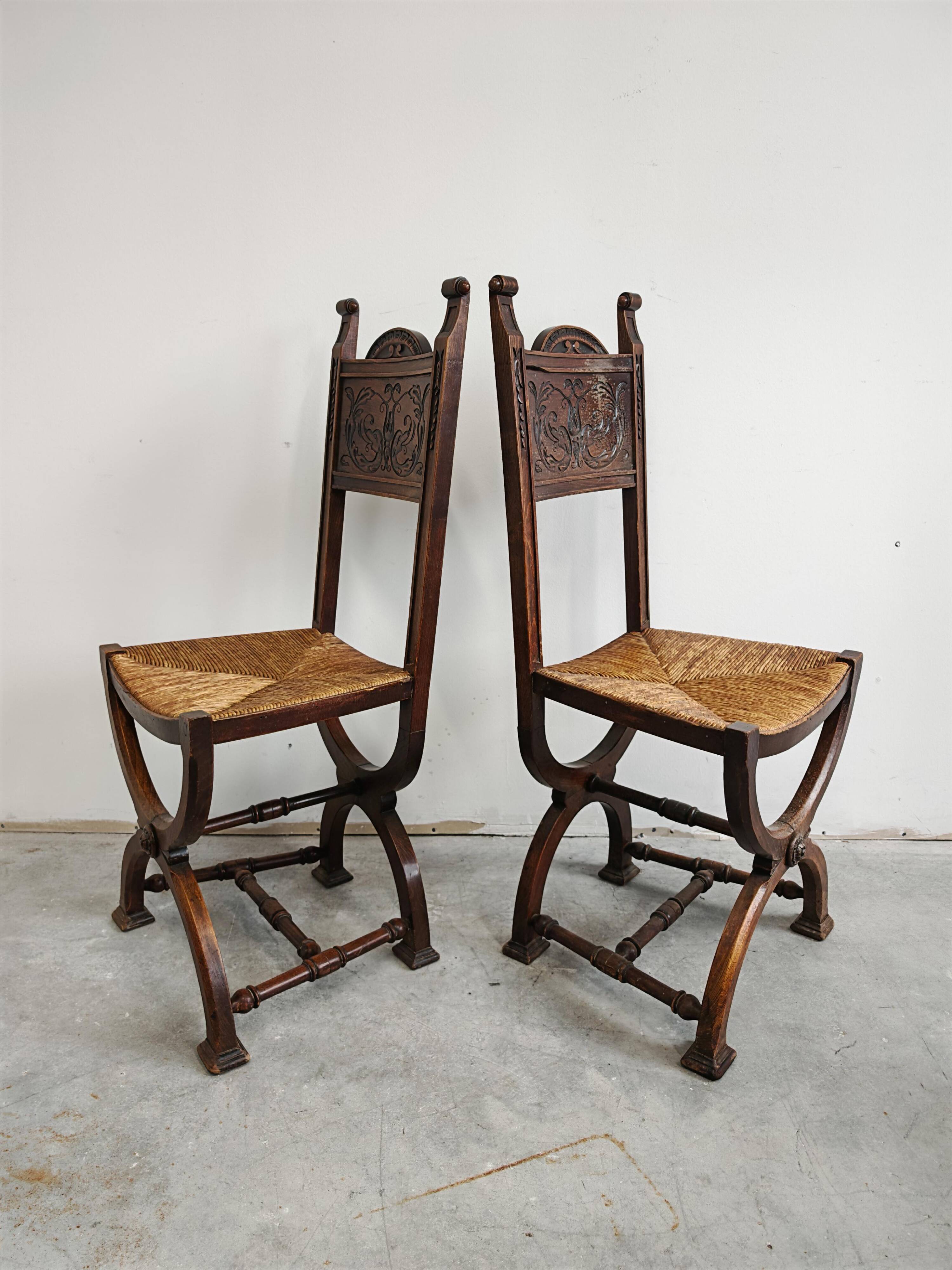 Pair of Neo-Renaissance oak chairs with straw seats, 1910