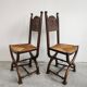 Pair of Neo-Renaissance oak chairs with straw seats, 1910