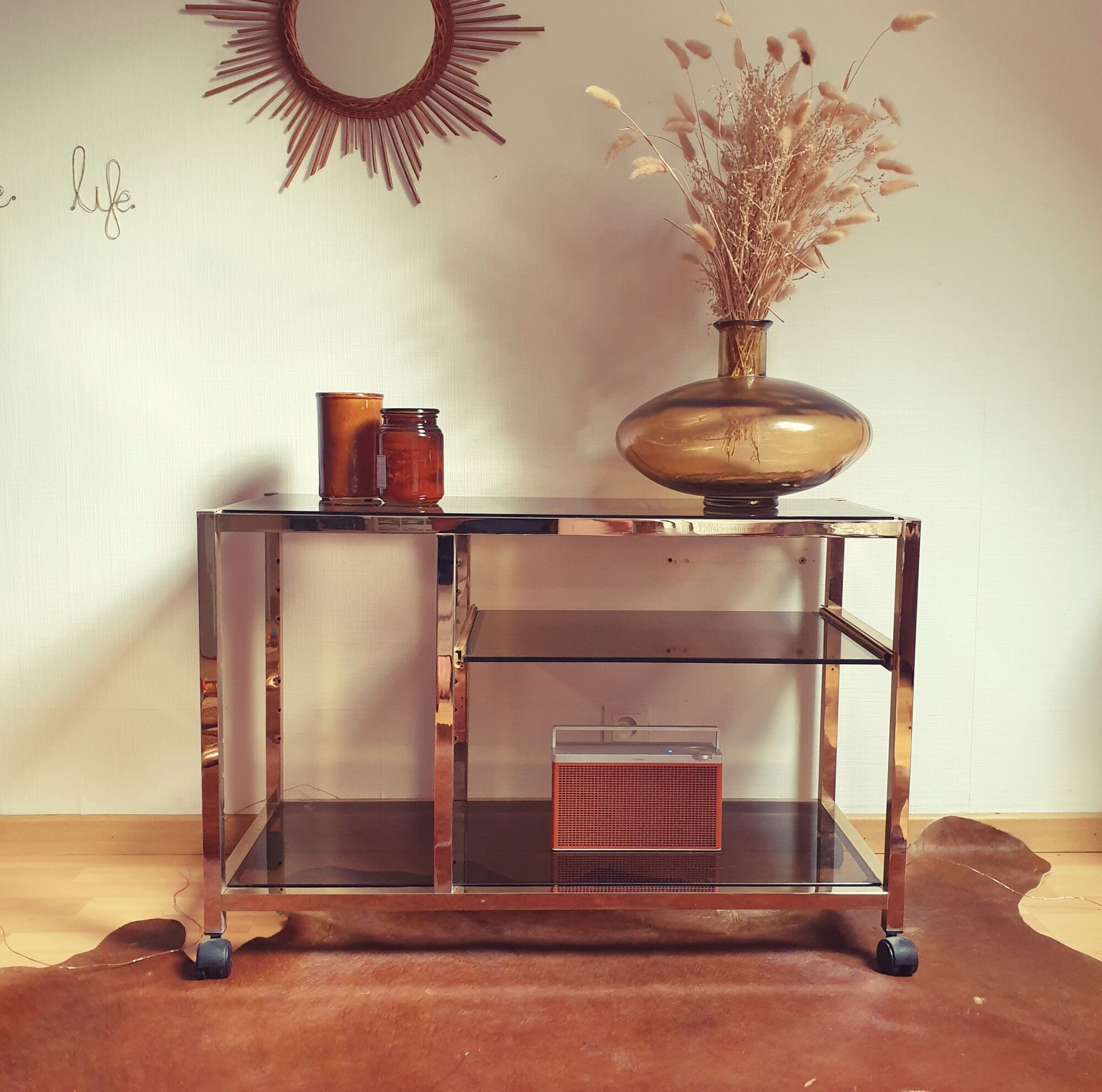 Service table with vintage brass wheels / smoked glass