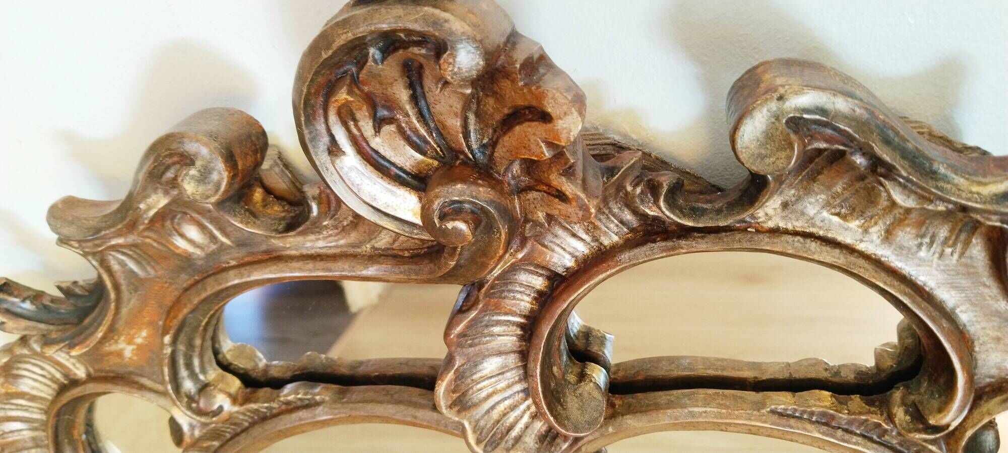 Antique mirror with rococo-style pareclose, in gilded wood, 19th century