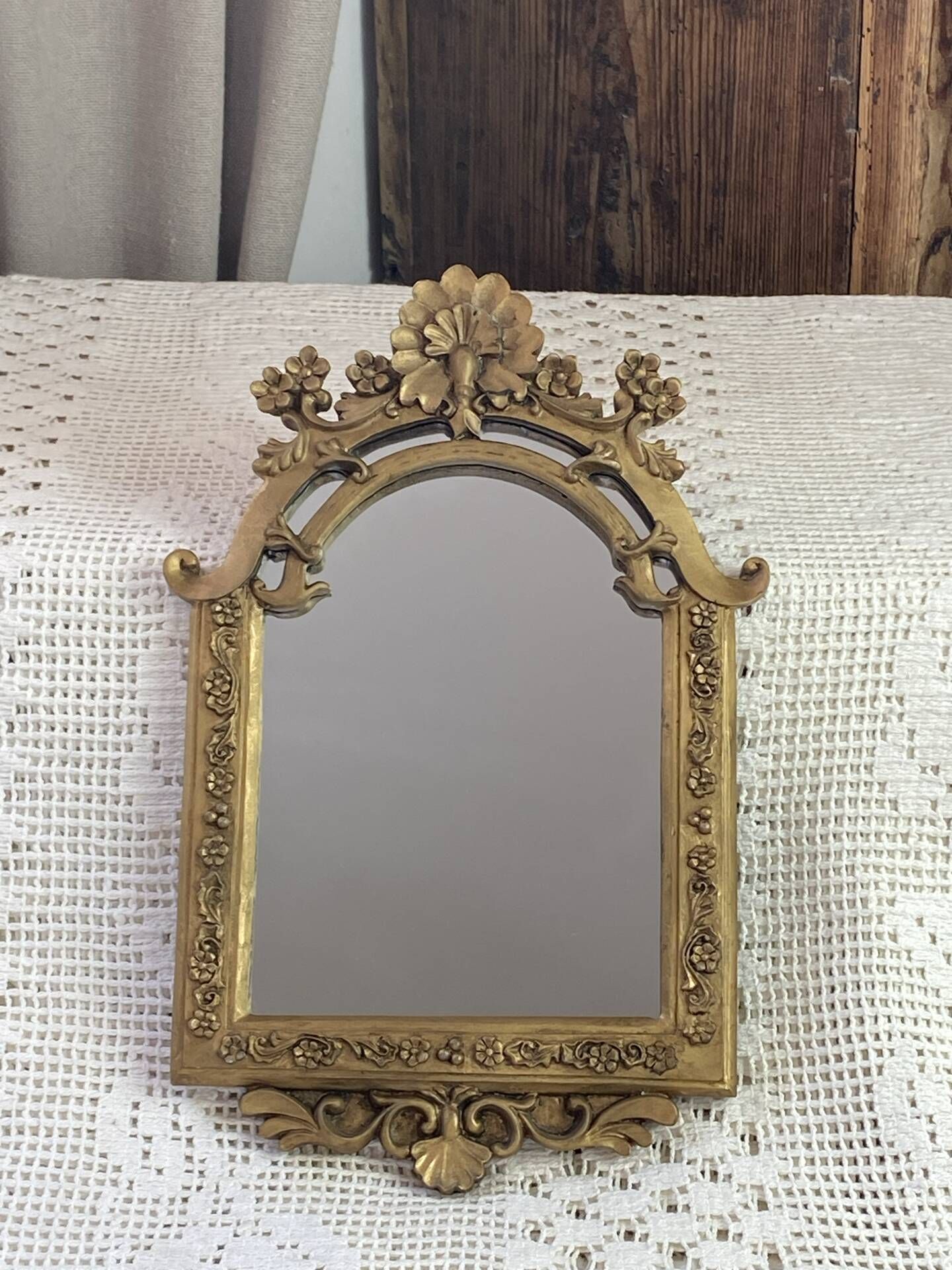 Baroque style mirror, decorated with shells and flowers.