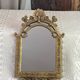 Baroque style mirror, decorated with shells and flowers.