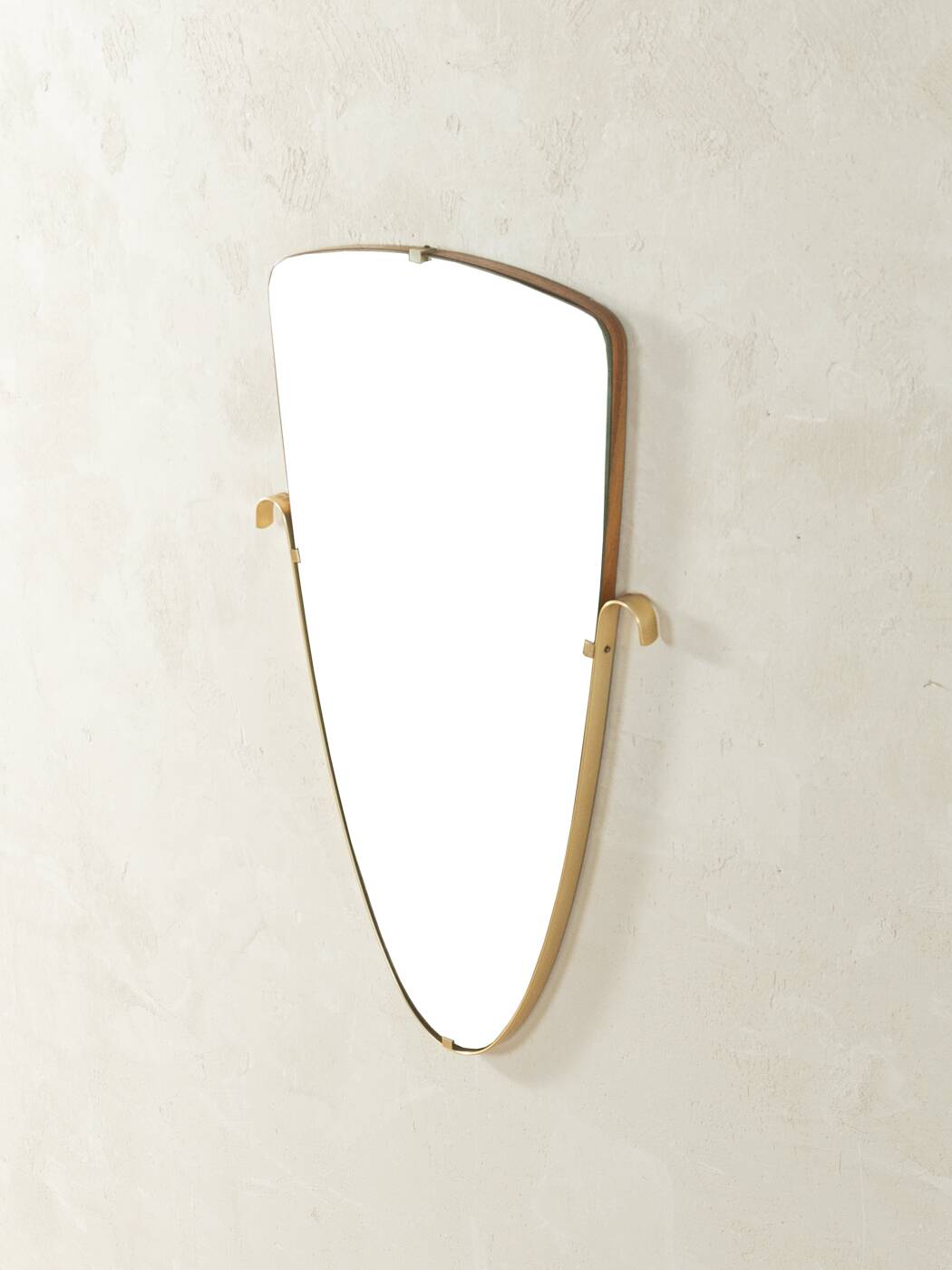 Elegant wall mirror from the 1950s with brass frame