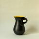 Glazed ceramic vase in black and yellow, in the style of Pol Chambost.