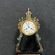 Portico clock of eventful shape of napoleon III period blackened wood inlaid with brass