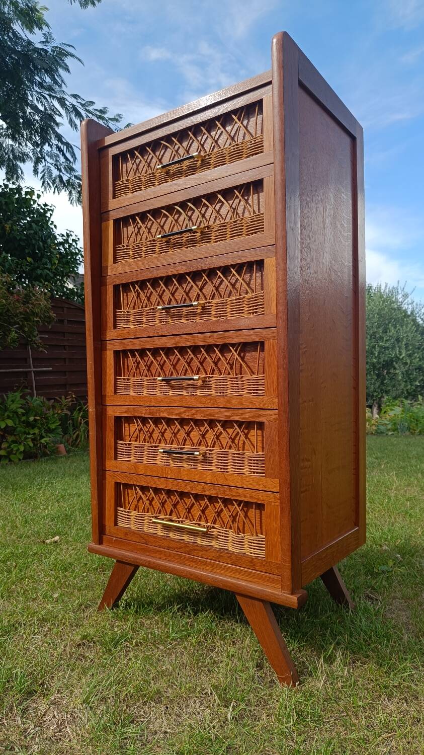 Tall chest of drawers in wood and rattan with splayed legs