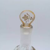 Old crystal carafe with golden decoration