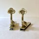 Brass wall supports for bathroom shelf, circa 1950.