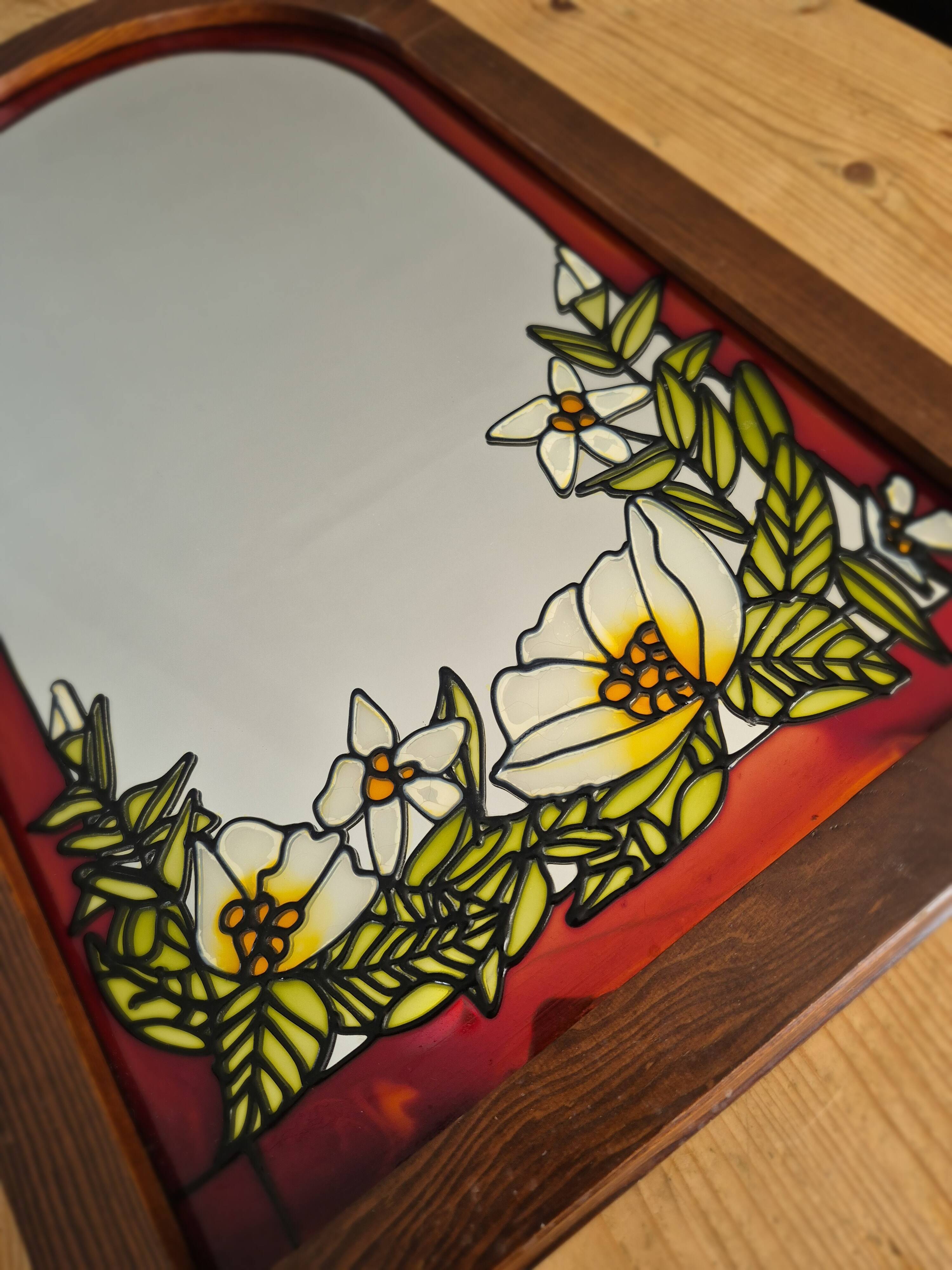 A pair of vintage stained glass style mirrors.