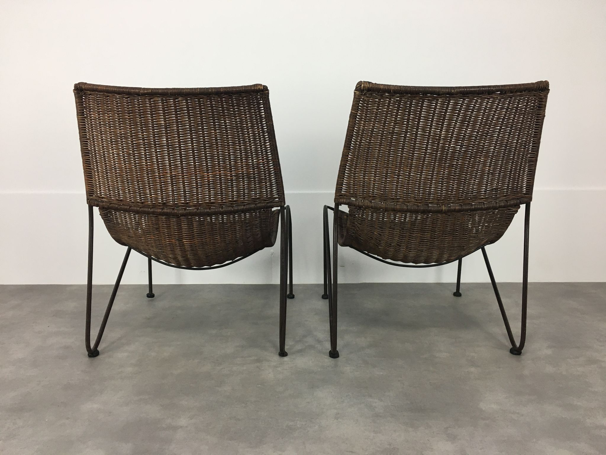 Pair of rattan and steel wire armchairs by frederick weinberg