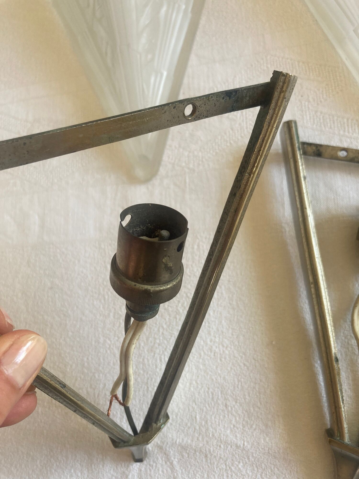 Pair of art deco metal and satin pressed glass sconces