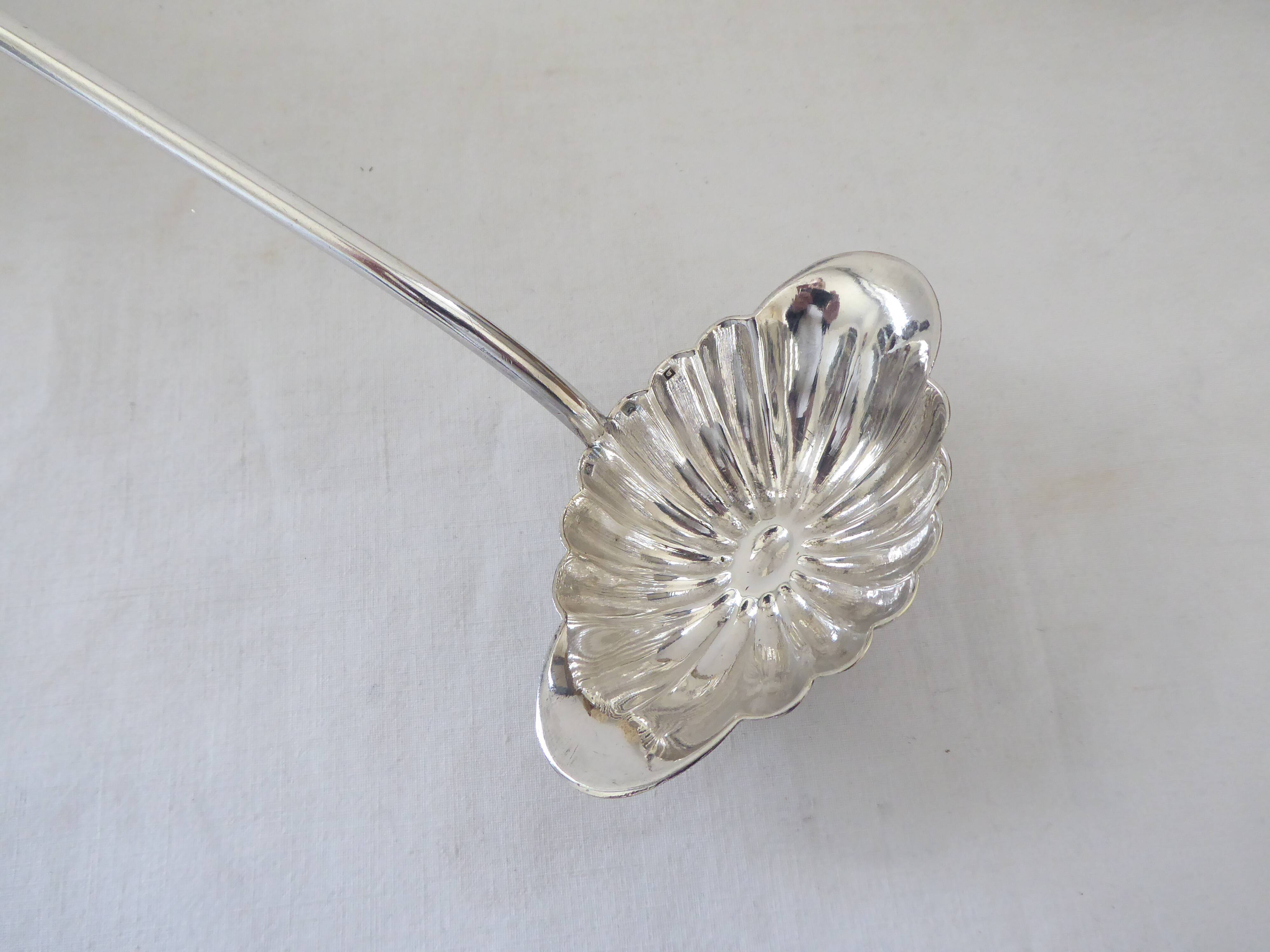 Silver metal sauce ladle