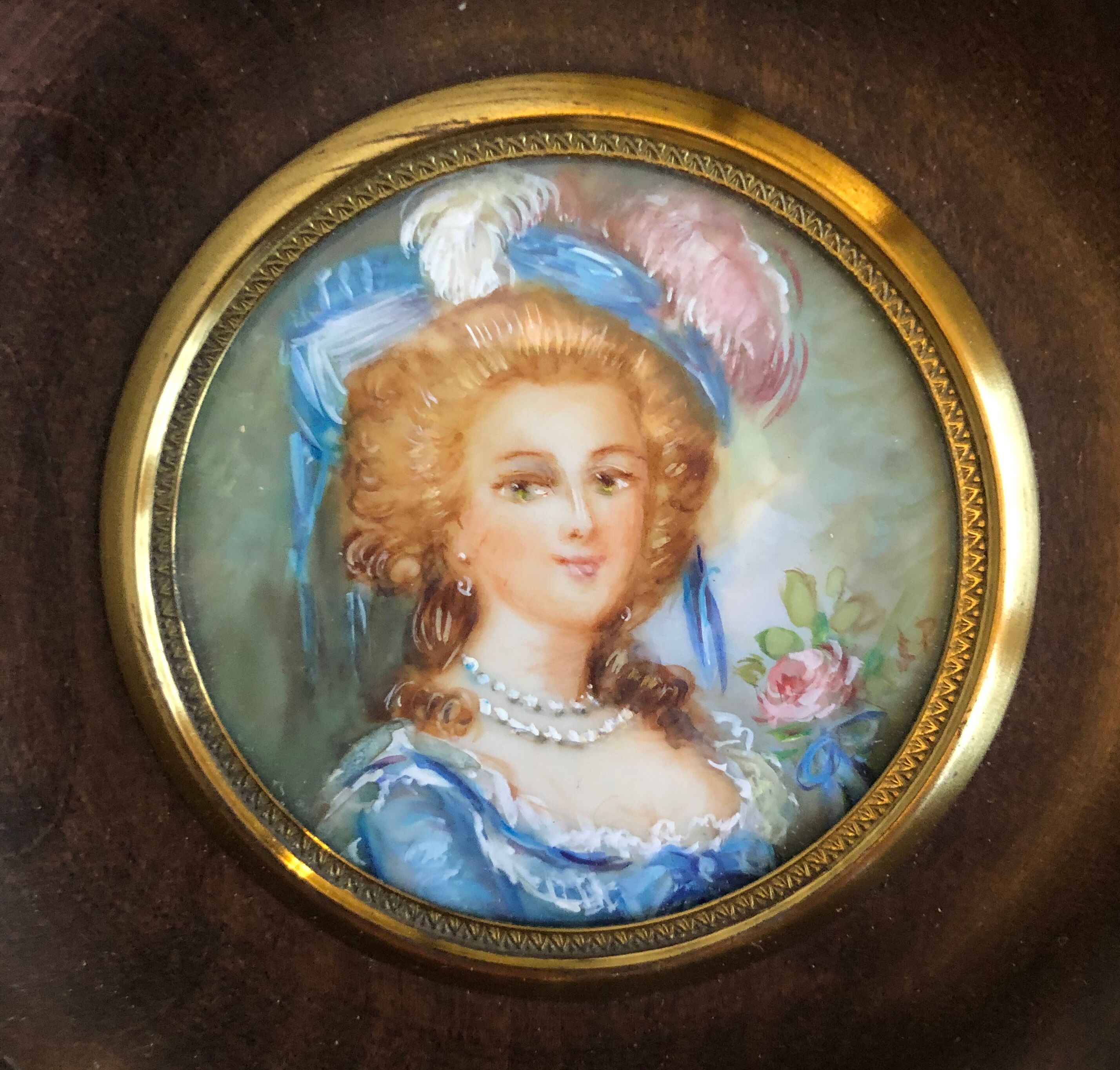 Elegant miniature in blue hat