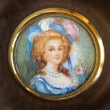 Elegant miniature in blue hat