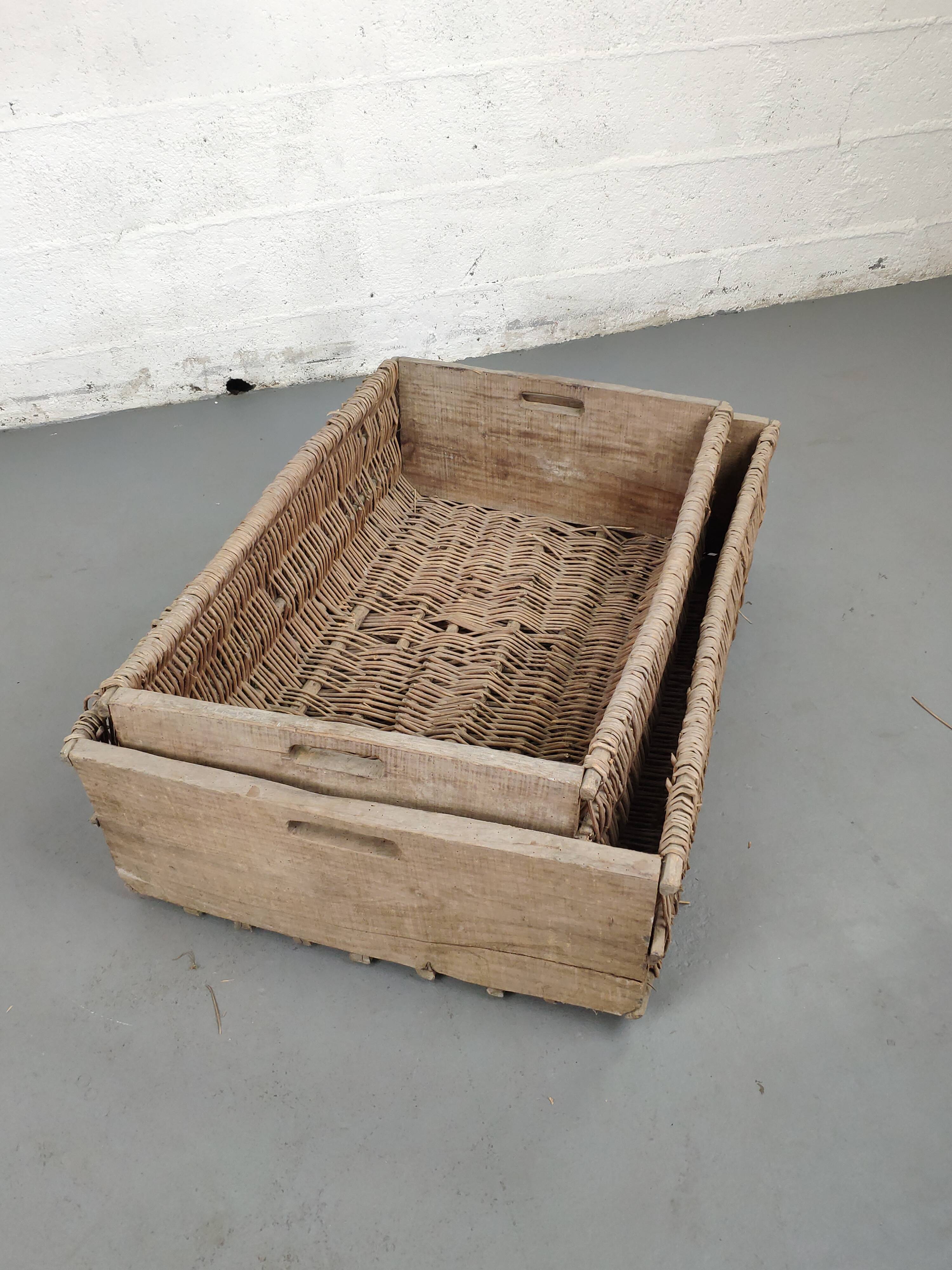 Set of 2 old large baskets with logs wood and wicker