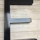 E metal letter