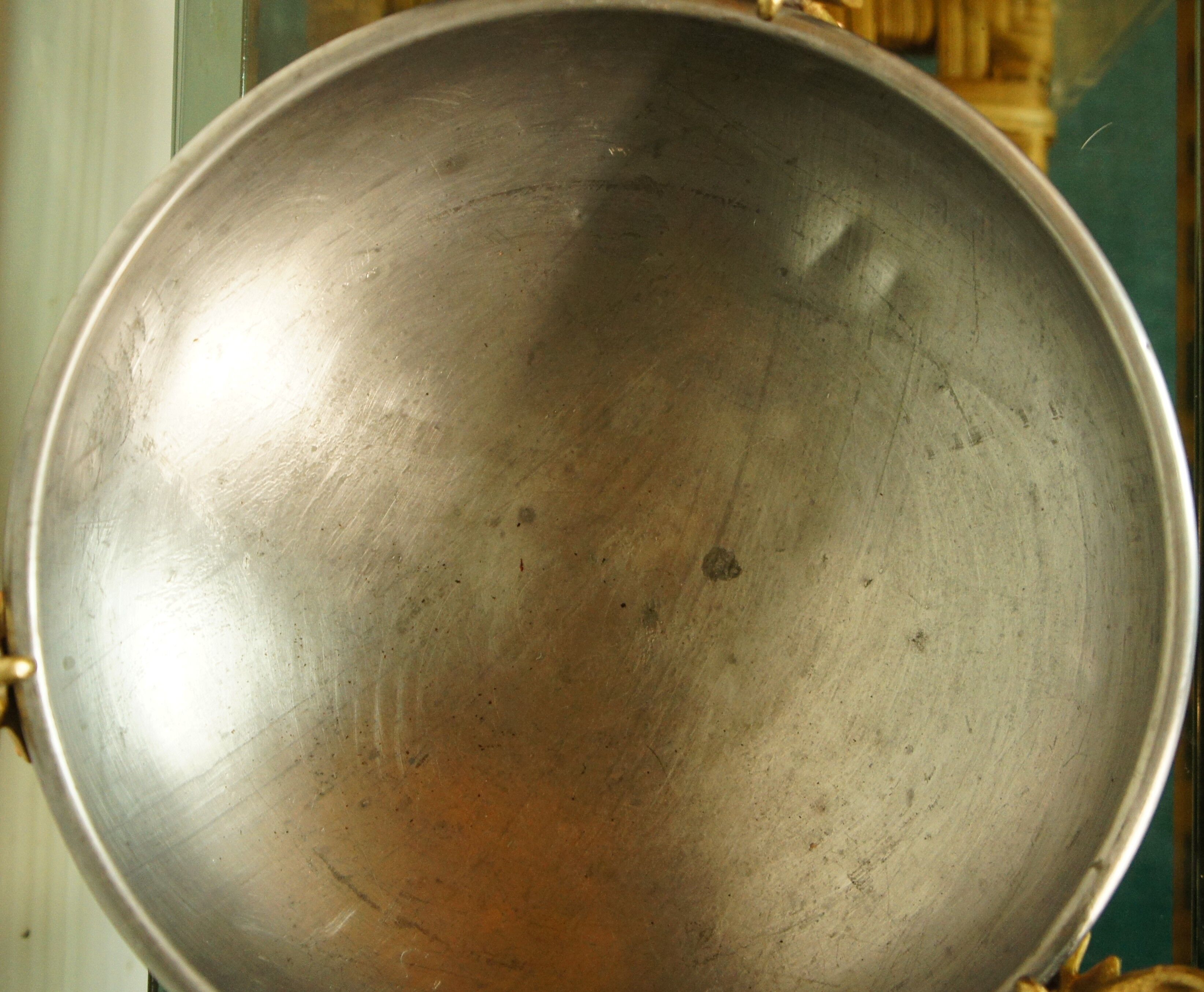 Copper cauldron with golden bronze bull heads