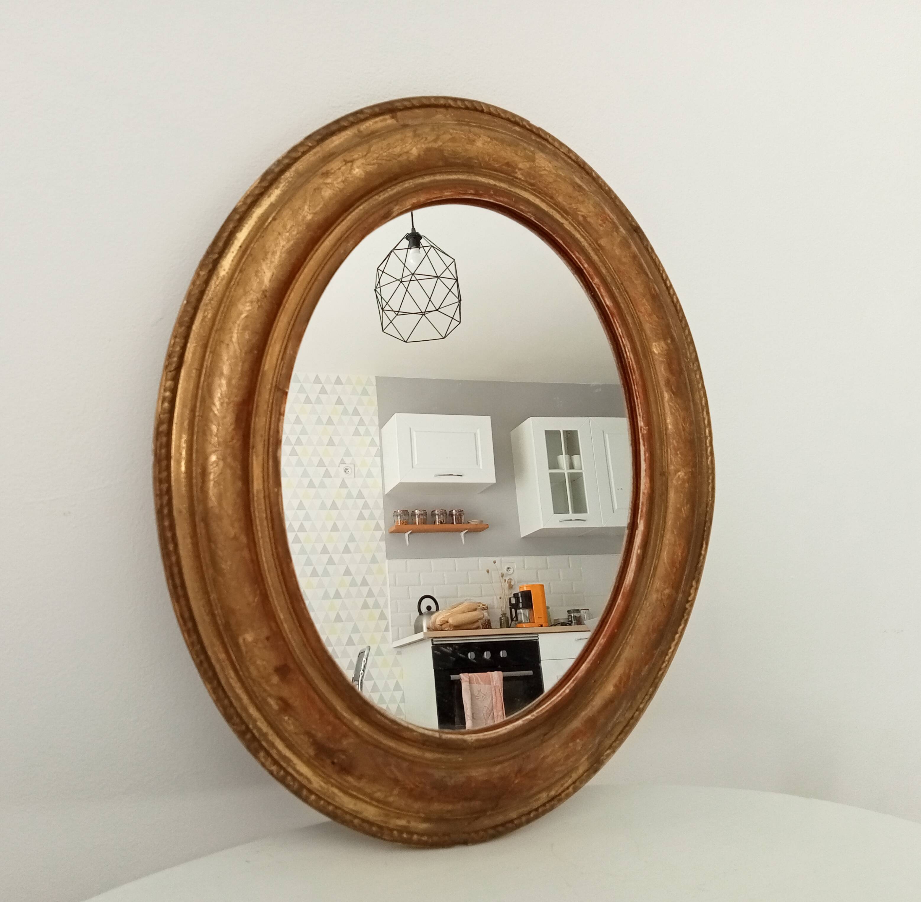 Louis Philippe 19th century oval gilded mirror in wood and stucco