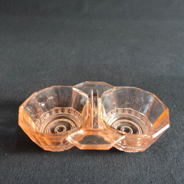 Salt shaker and pepper shaker in pink glass