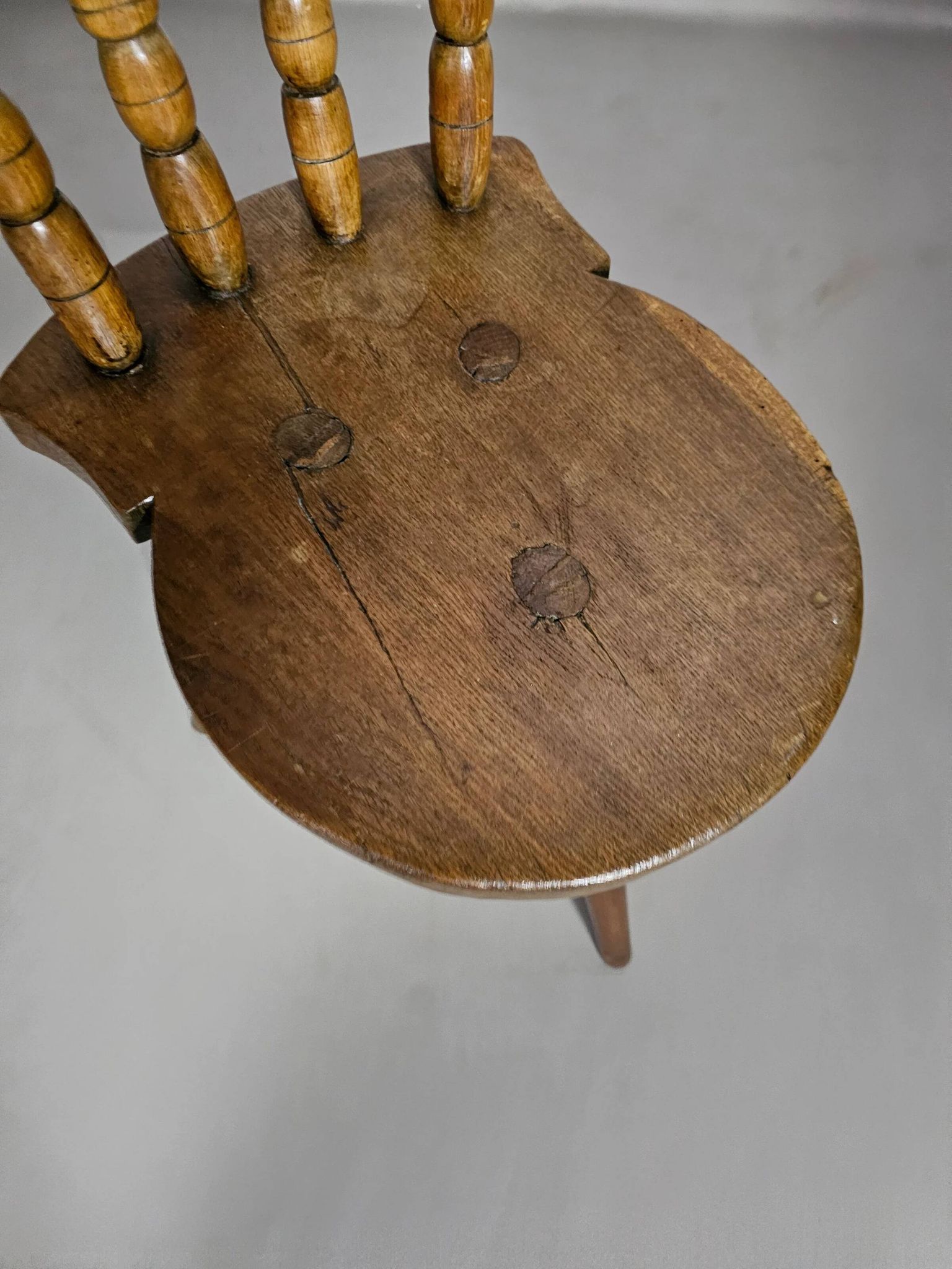 Old farmers tripod chair for decorative use
