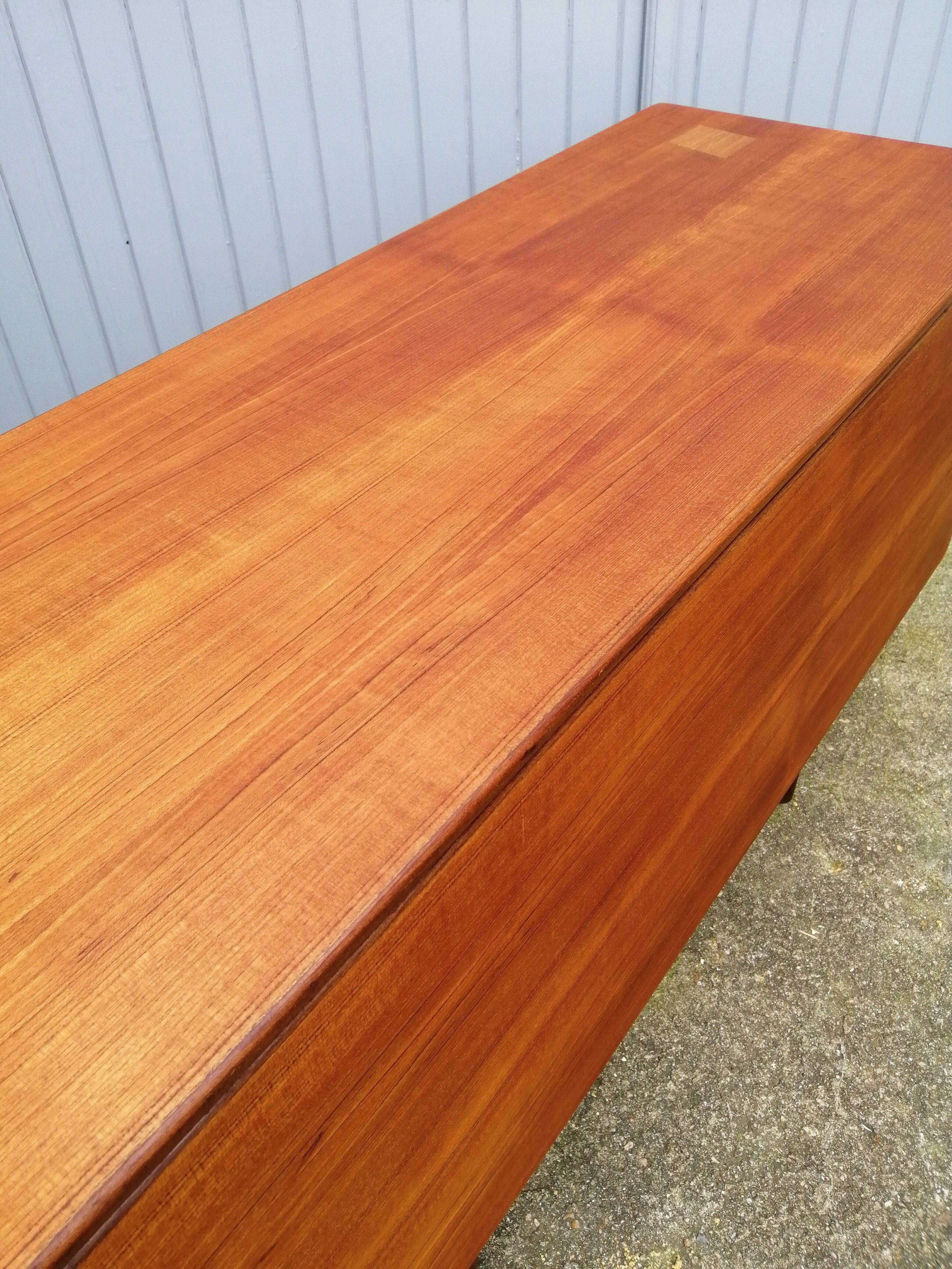 Dining table by Ib Kofod Larsen of the 60s