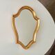 Vintage baroque mirror in gilded wood in the Louis XV style.