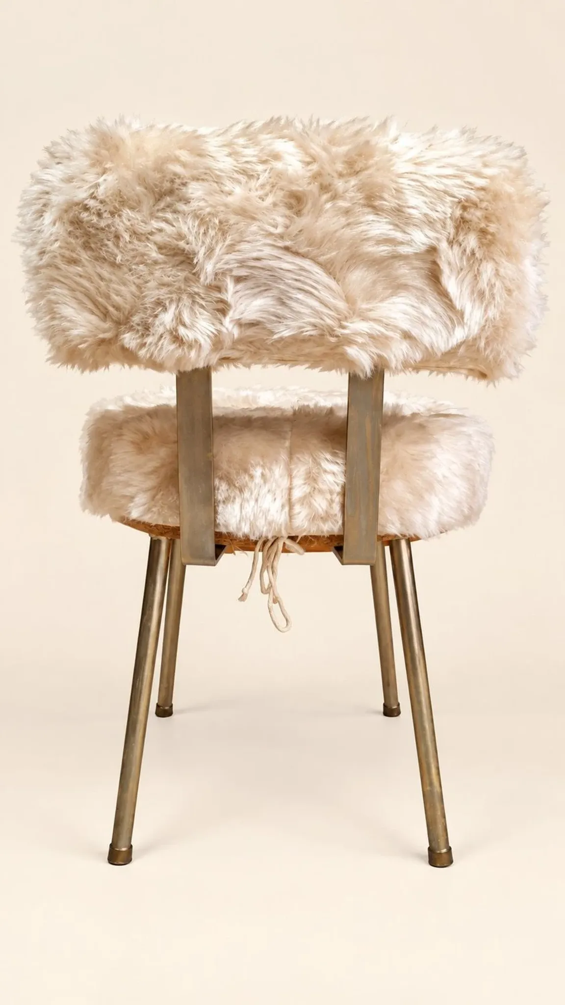 Vintage 1960s dressing table chair with faux fur and golden legs.