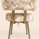 Vintage 1960s dressing table chair with faux fur and golden legs.