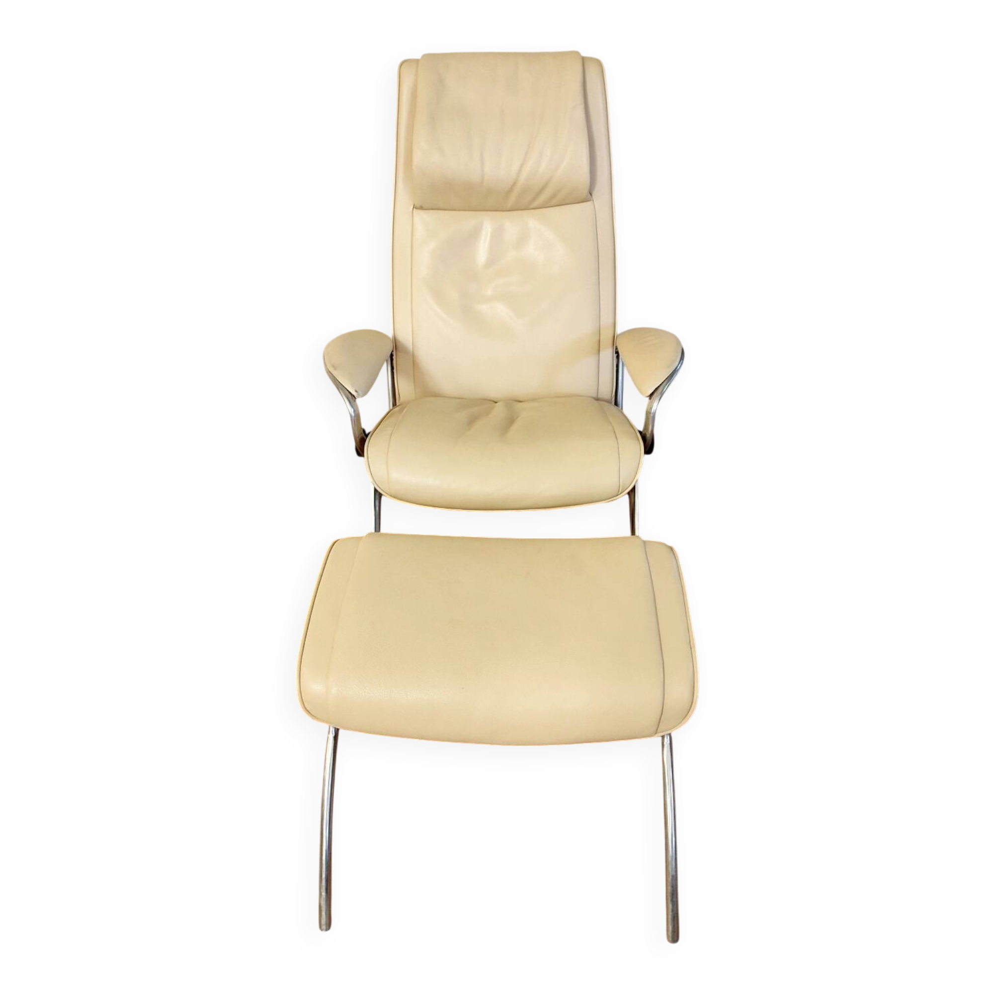 Beige leather armchair and footstool