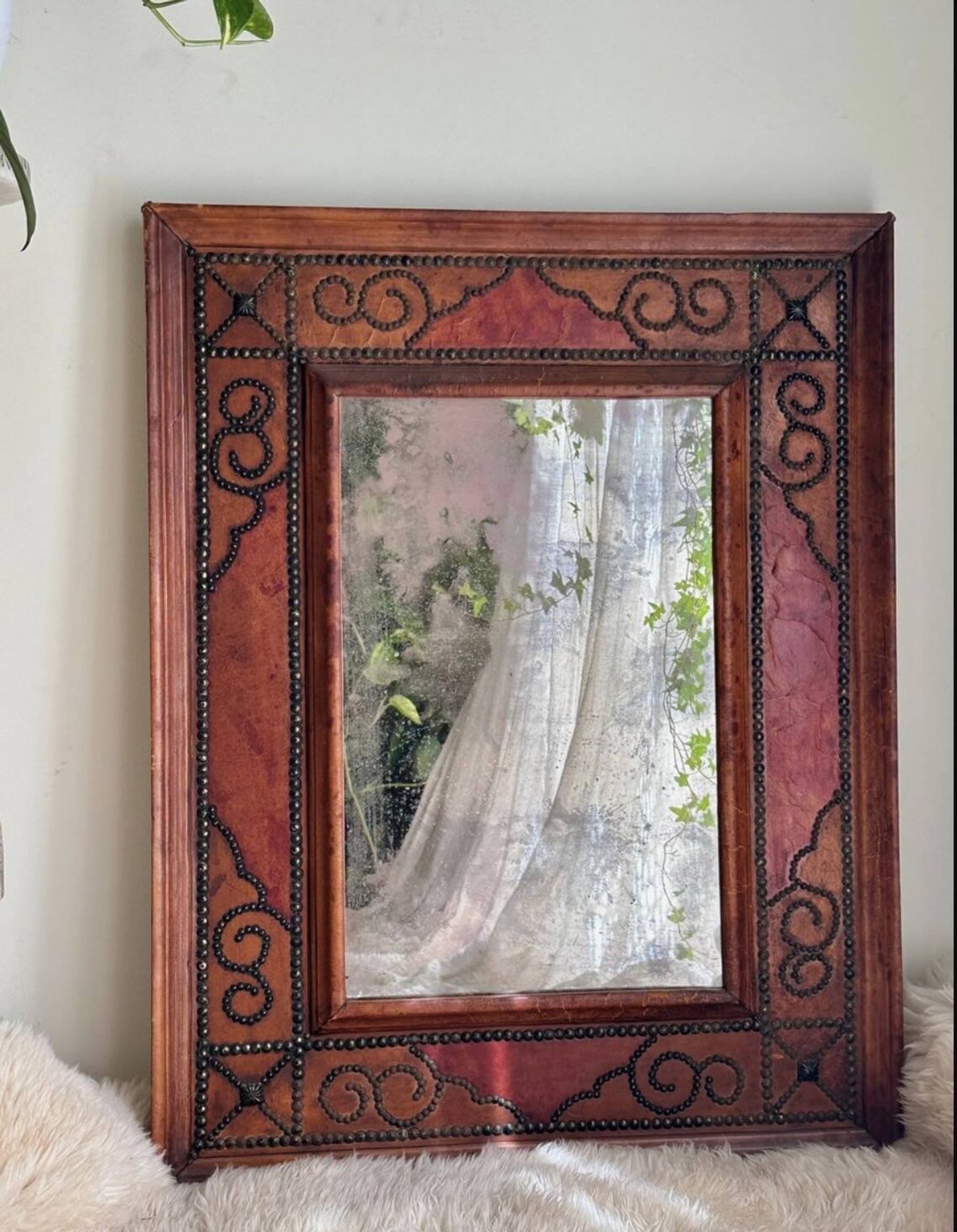 Antique mirror designed by "Pierre Lottier". Leather and nails. France 1