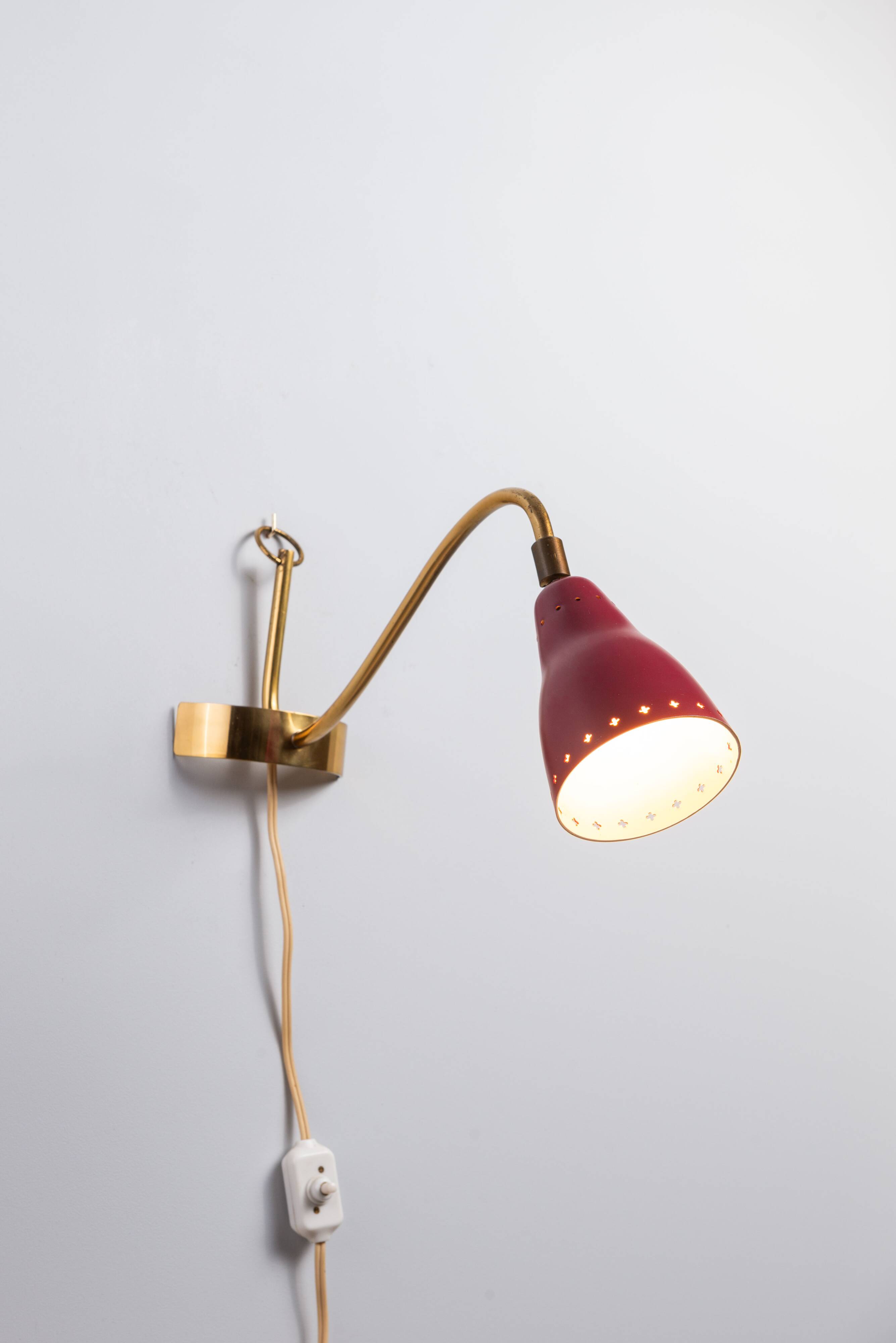 Brass wall lamp with perforated metal shade, 1950s, Sweden