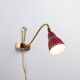 Brass wall lamp with perforated metal shade, 1950s, Sweden