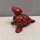Beautiful seal in ceramic with metallic red glaze.