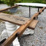 White lacquered oak table, richly carved central leg. Late 19th century