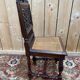 6 High Era chairs in carved solid oak and rattan caning.