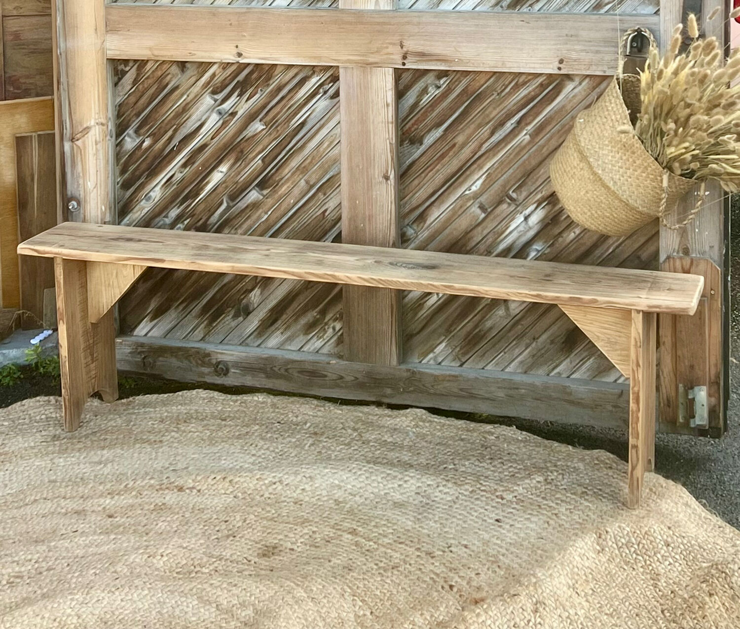 Pair of old farmhouse benches made of raw solid wood.