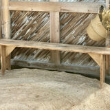 Pair of old farmhouse benches made of raw solid wood.