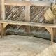 Pair of old farmhouse benches made of raw solid wood.