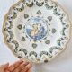 Antique plate in Moustiers faience, hand-painted, decorated with an s
