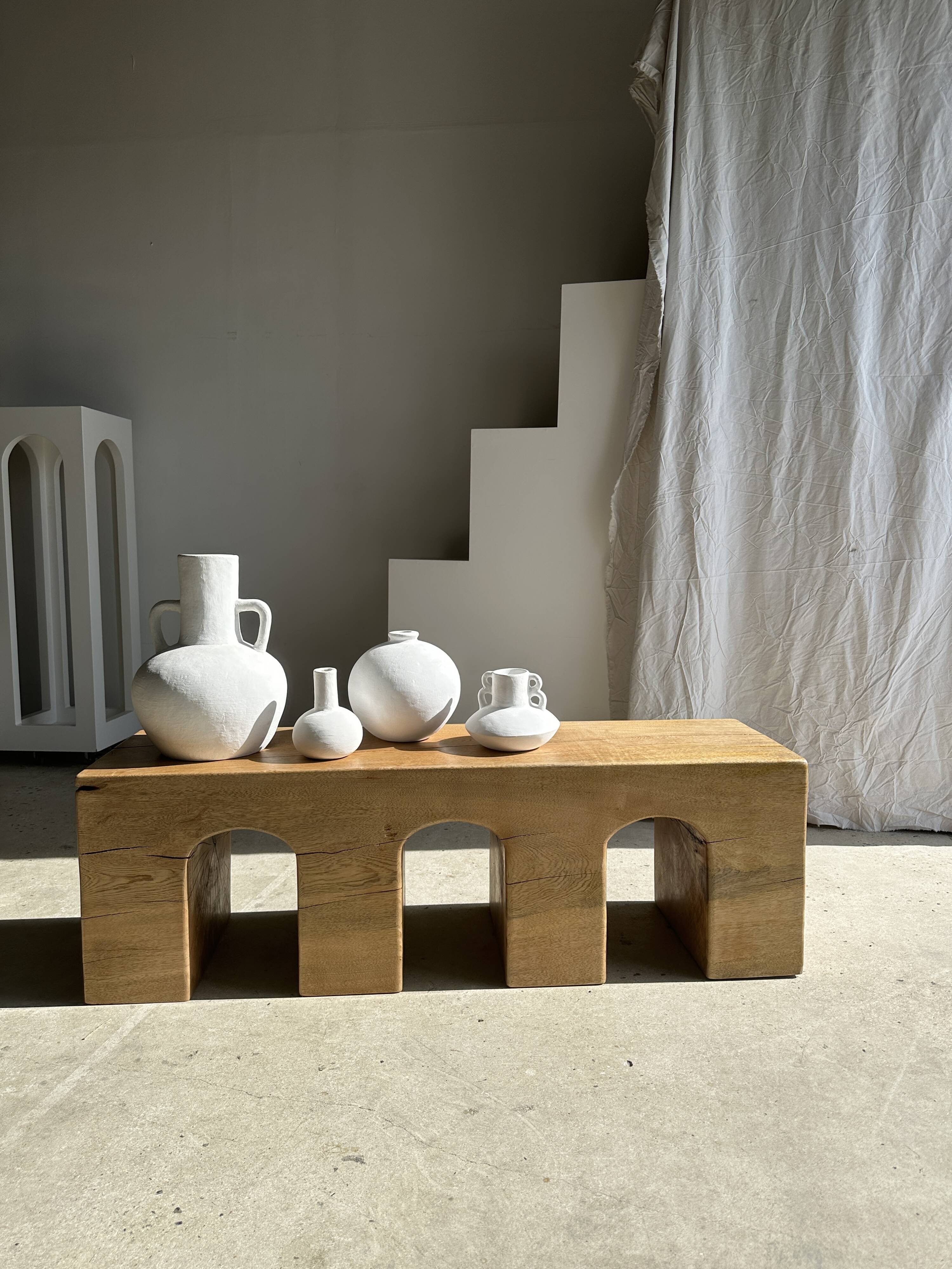 Solid monoxyl wood bench with carved 3-arch base - Natural wood color