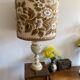 Antique table lamp in marble and tapestry
