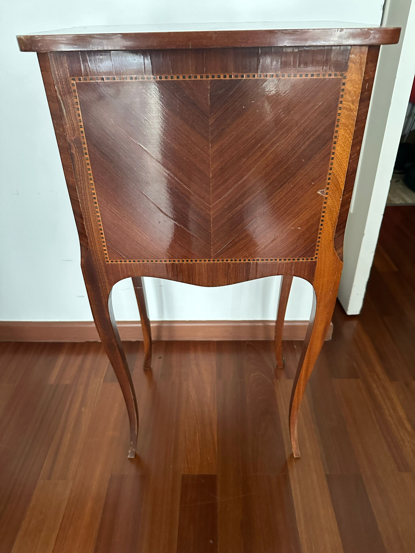 Small bedside table in marquetry in the Louis XV style.