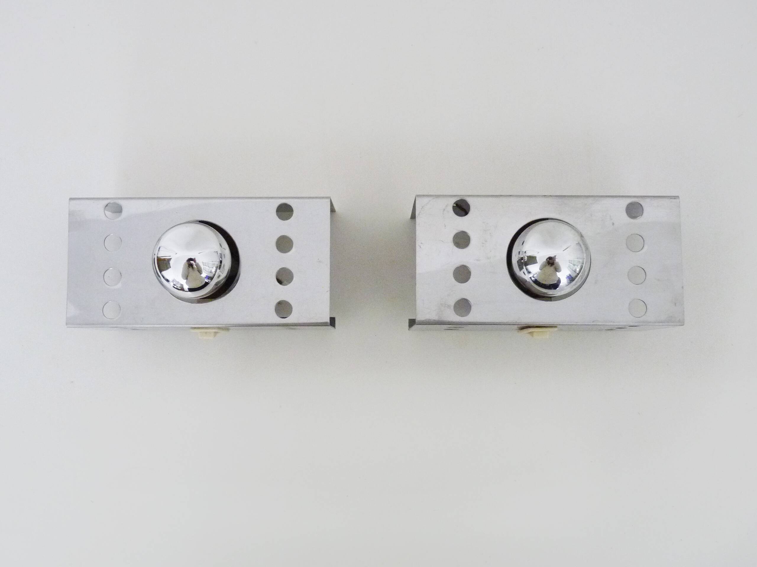 Pair of vintage chrome stainless steel wall sconces. Space Age