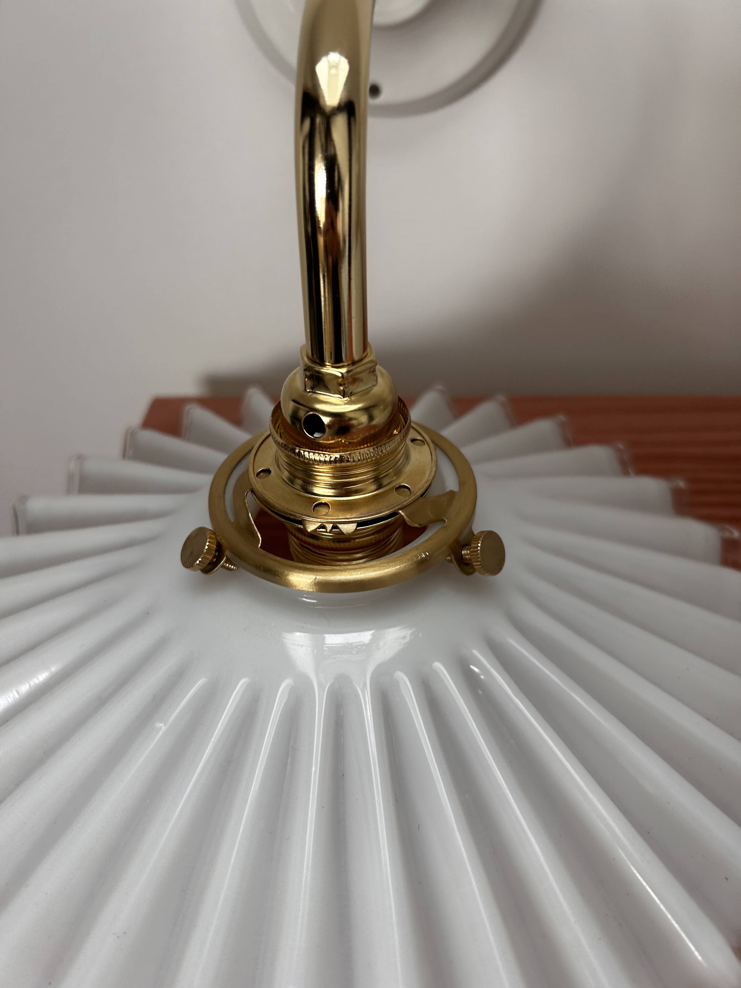 Two wall sconces in serrated white opaline