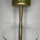 Vintage brass floor ashtray with glass shelf in Empire style.