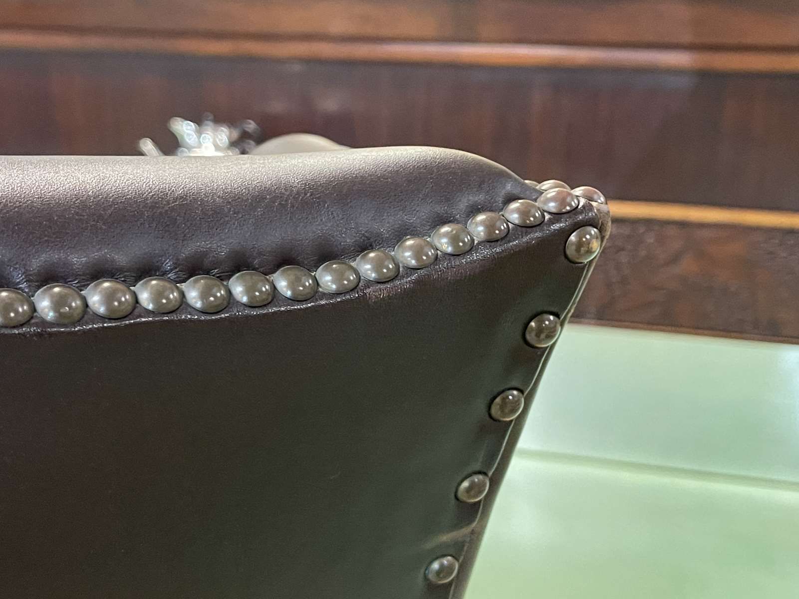 Chesterfield armchair with brown leather ears from the 1990s in very good condition