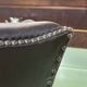 Chesterfield armchair with brown leather ears from the 1990s in very good condition