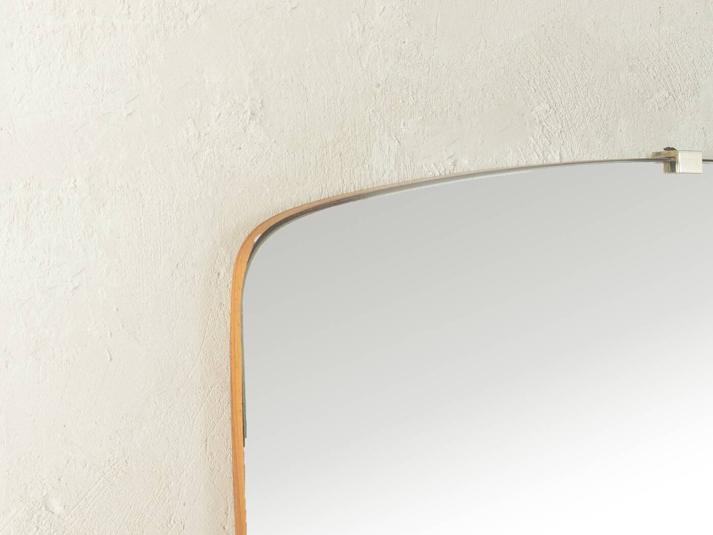 Elegant wall mirror from the 1950s with brass frame