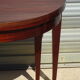 Half-moon console table, extendable in Empire style.